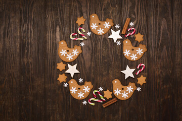Gingerbread cookies wreath with Christmas and New Year decor. Concept of holiday winter food.