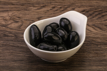 Pickled black olives in the bowl
