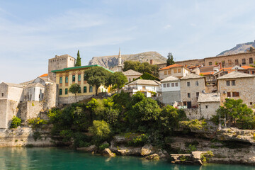 Fototapeta na wymiar View of beautiful historic buildings in the Old Town of Mostar. Bosnia and Herzegovina
