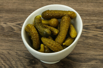Pickled gherkin in the bowl