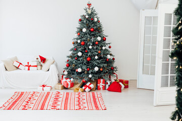 White room christmas tree pine fireplace with new year decoration gifts