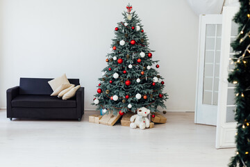 White room christmas tree pine fireplace with new year decoration gifts