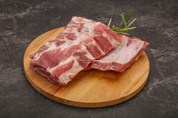 Raw pork ribs served rosemary