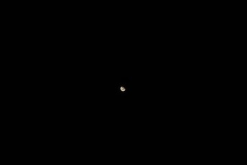 The distant moon at night