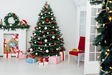 Fototapeta na wymiar White room Christmas tree pine with gifts new year interior decor