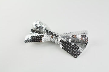 bow tie made of sequins on a white background
