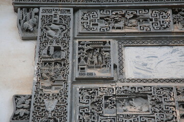 Close up of the decoration detail brick carving on the building entrance wall of Chinese Huizhou Architecture in Wuyuan county, Jiangxi province, China.