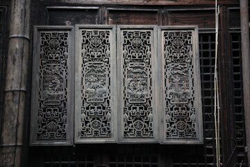 Close up of the decoration detail wood carving on on the window of Chinese Huizhou wooden...