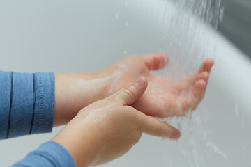 child is washing his hands, protection from viruses