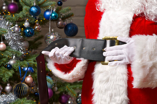 Santa Claus Tightens The Belt On His Big Belly