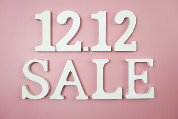 12.12 Sale alphabet letter on pink background