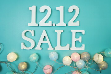 12.12 Sale alphabet letter with LED cotton balls on blue background