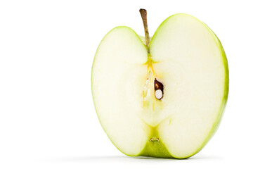 Half cut green apple. Studio photo isolated on white background. Selective focus on object.