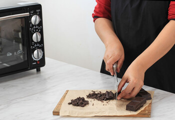 Chopping Dark  Cooking Chocolate Block, Preparation Baking in the Kitchen 
