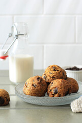 Chocolate Chip Cookies Background with Copy Space on Gray Wooden Table. Homemade Food/Snack Serve with Milk for Kids. Selected Focus