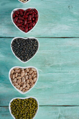 assortment of beans on wooden surface