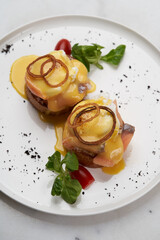 Eggs Benedict with smoked salmon, poached eggs
