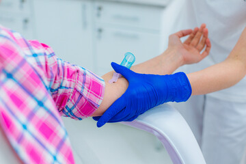 Obraz premium Medical worker adjusting vein catheter close up image
