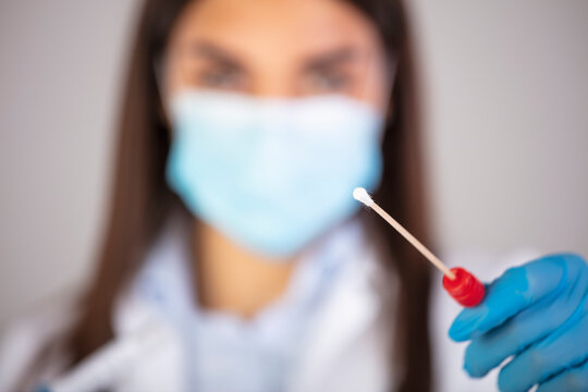 Corona virus Covid-19 respiratory sputum specimen swab test tube with gloves, mask and biohazard bag. Coronavirus or COVID-19 concept. COVID-19 Diagnostic Test. Diagnostic testing for COVID-19.