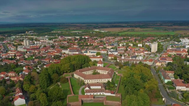 Sarvar, Hungary - 4K drone flying above the famous Castle of Sarvar (Nadasdy castle) on a sunny summer day with green trees and blue sky. The town of Sarvar has been located in Vas county