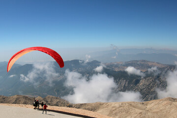paragliding in the sky against the background of mountains