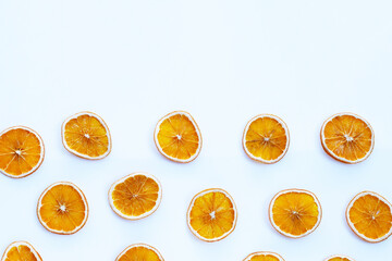 Dried orange slices on white background.
