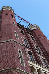 Moscow Electric Lamp Plant. Construction of industrial, industrial building. Ancient house facade....