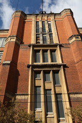 Moscow Electric Lamp Plant. Construction of industrial, industrial building. Ancient house facade....