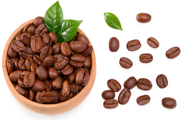 roasted coffee beans with green leaves in wooden bowl isolated on white background. Clipping path and full depth of field. Top view