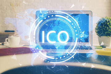 Multi exposure of blockchain and crypto economy theme hologram and table with computer background. Concept of bitcoin cryptocurrency.