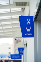 Female toilet sign outside the building
