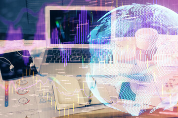 Double exposure of graph and financial info and work space with computer background. Concept of international online trading.