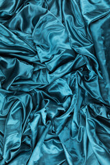 Texture or background of silk fabric. Blue fabric.