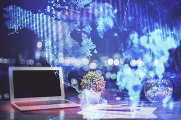 Financial chart drawing and table with computer on background. Double exposure. Concept of...