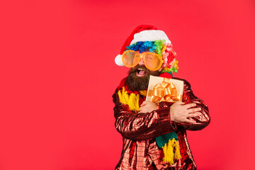 Christmas gift. Cheerful guy colorful hairstyle. Funny man with beard. Cool Specials. Winter...