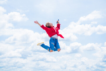 Fototapeta na wymiar cheerful child fly high in the sky, full of energy