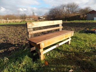 wooden bench standing on the floor