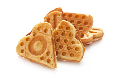 Cookies waffles in shape of heart on white background.
