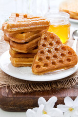Morning breakfast with waffles in the shape of heart, homemade food