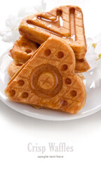 Cookies waffles in shape of heart on white background.