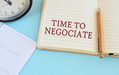 Notebook with text Time To Negotiate on bright blue background.Conceptual photo the seller accepts...