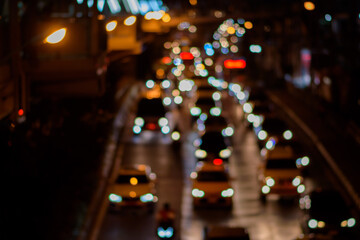 Fototapeta na wymiar Bokeh from car lights in Bangkok, Thailand, Blurred background.