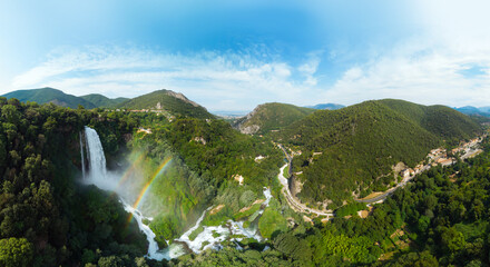 Aerial view. Water discharge, strong, maximum flow. Rainbow. The Cascata delle Marmore is a the largest man-made waterfall. Terni in Umbria Italy. Hydroelectric power plant Ultra wide resolution