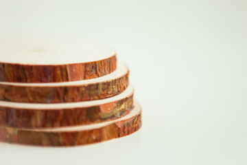 Wood cut, round shape on the white background. Round wooden saw cut. Copy space for text