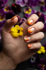 Hand of the girl with flowers