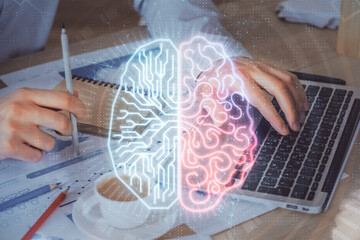 Businessman with computer background with brain theme hologram. Concept of brainstorm. Multi exposure.