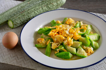 Zucchini puff with egg in white dish Popular Thai food