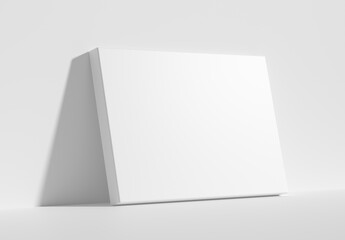 Horizontal rectangular poster on floor leaning at wall diagonal view