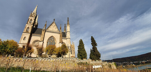 Fototapeta premium Remagen Germany November 2020 Apollinariskirche Remagen with view on the Rhine in beautiful autumn weather