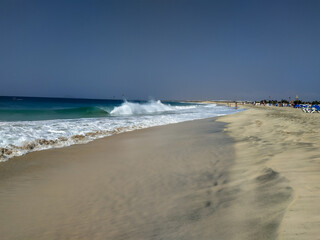 Ocean and sandy beach on sunny day on island Sal, Cape Verde
